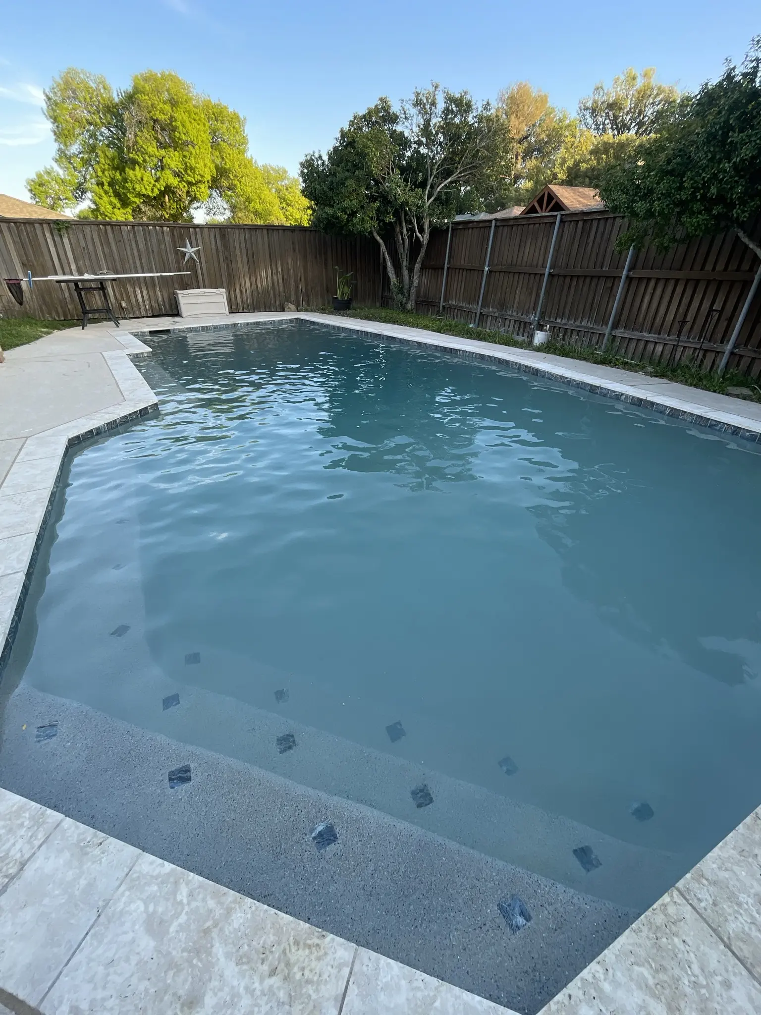 Octagonal pool with perfectly clear water after service