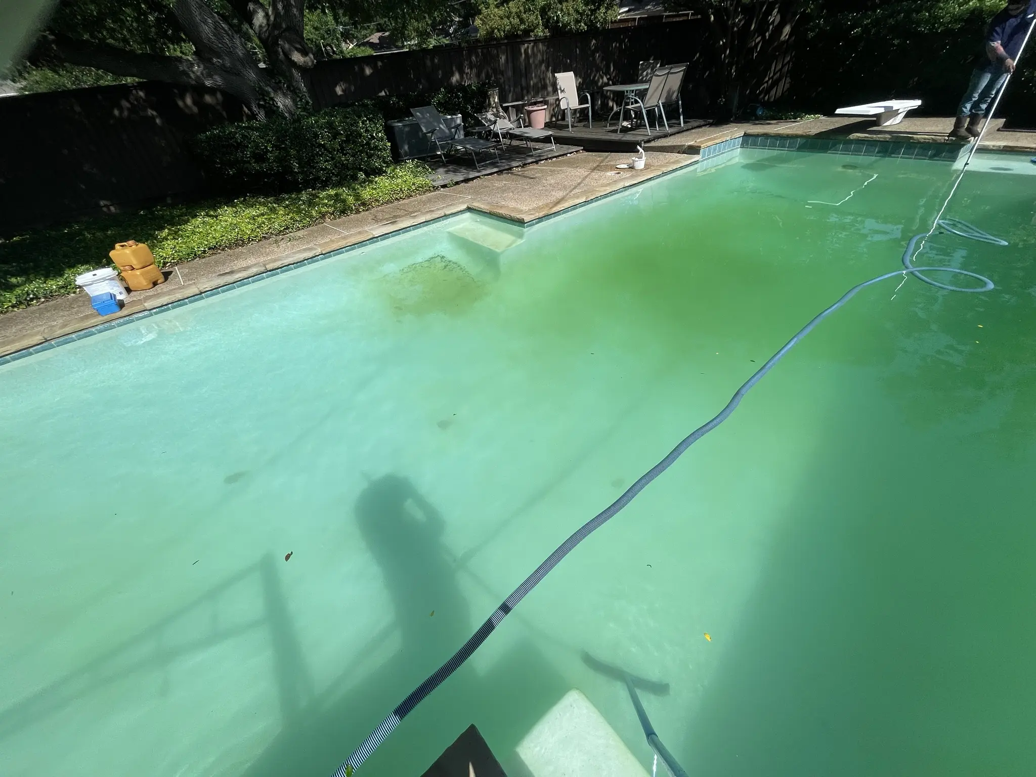Vacuuming in progress on a rectangular pool